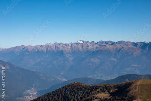 Panoramic view from mountain peak of Latschur, Gailtal Alps, Austria, Europe. Majestic mountain ridges in High Tauern. Wanderlust in wilderness of alpine landscape. Tranquility in remote Austrian Alps photo