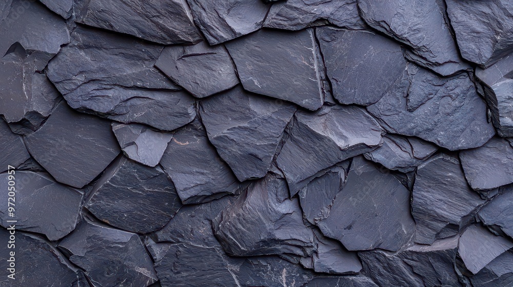 Black rough grainy stone texture, dark background for design or presentation with a modern twist. Black rough grainy stone texture, dark background for design or presentation with a modern twist.