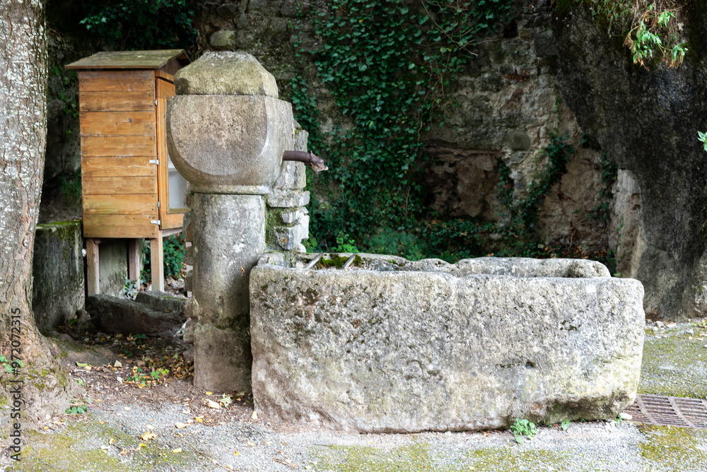 old stone water feature in a small village in south of France old stone water feature in a small village in south of France