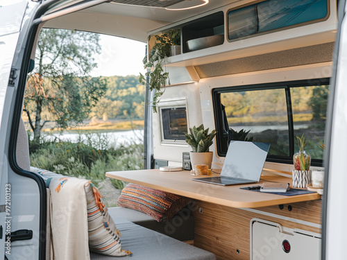 Interior view of a camper van with a work-from-home setup photo