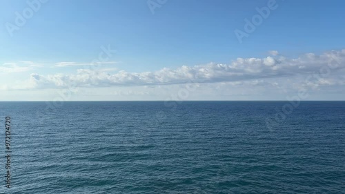 Wallpaper Mural Blue sea flowing calm water and long cloud in the sky. Torontodigital.ca