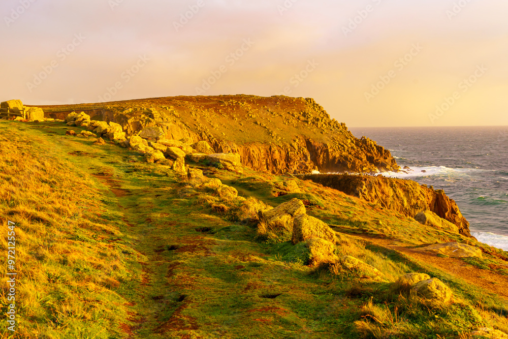 Sunset view of the Lands End coastline landscape, Cornwall