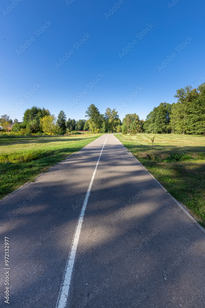 A road with a white line down the middle A road with a white line down the middle