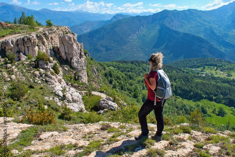Obraz premium Woman hiker watching beautiful scenery of Spanish Perenees