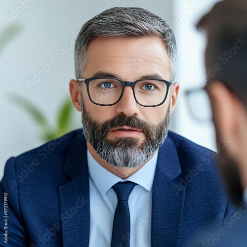 Senior manager using body language to influence a deal, negotiation influence, non-verbal communication photo