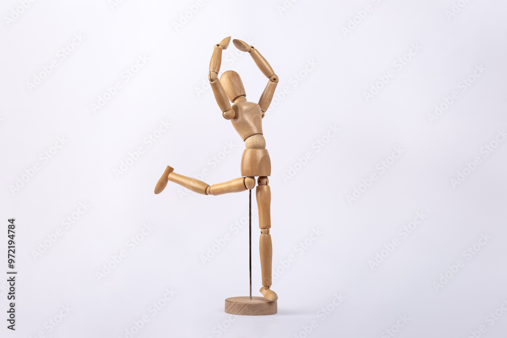Wooden dummy representing a person dancing, isolated on white background. Copy space. Concept of dance Wooden dummy representing a person dancing, isolated on white background. Copy space. Concept of dance