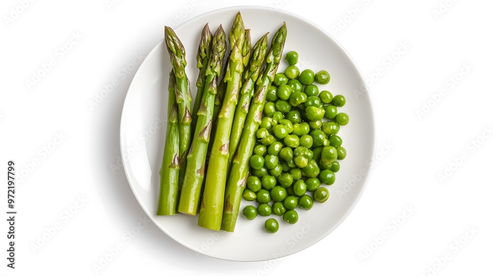 Fresh green asparagus and peas on white plate: a healthy vegetarian meal Fresh green asparagus and peas on white plate: a healthy vegetarian meal