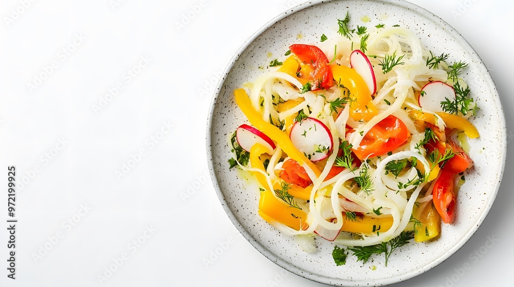 Fresh vegetable salad with fennel, radish, and tomatoes on a white plate Fresh vegetable salad with fennel, radish, and tomatoes on a white plate