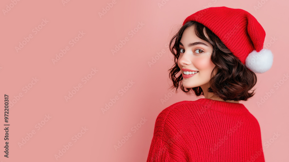 Canadian woman smiling in christmas wear and santa claus hat isolated on pastel Canadian woman smiling in christmas wear and santa claus hat isolated on pastel