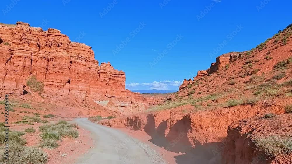 Charyn Canyon, Valley of Castles. The excellence of Kazakhstan. Panorama of natural unusual landscape. The red canyon of extraordinary beauty looks like a Martian landscape. Charyn Canyon, Valley of Castles. The excellence of Kazakhstan. Panorama of natural unusual landscape. The red canyon of extraordinary beauty looks like a Martian landscape.