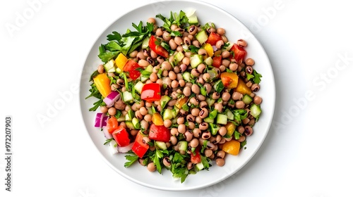 Fresh black-eyed pea salad with colorful vegetables and herbs in a white bowl