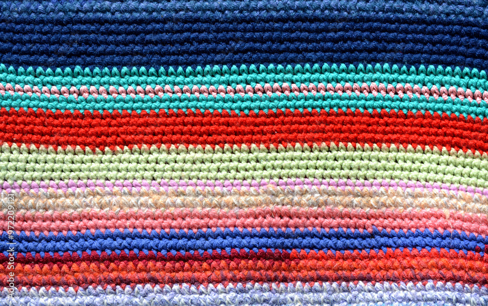 Knitted and colored stripes Handmade carpet. Cozy background Knitted and colored stripes Handmade carpet. Cozy background