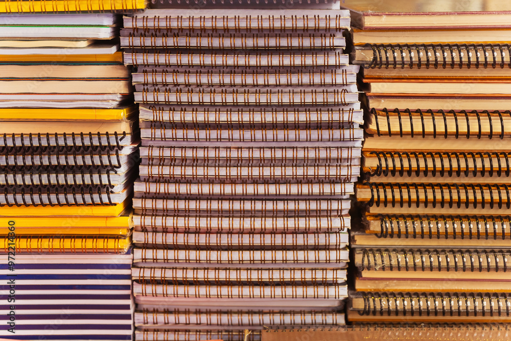 Obraz premium Stack of notebooks on the spring close -up