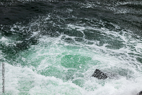 Sea waves splashing on rocks