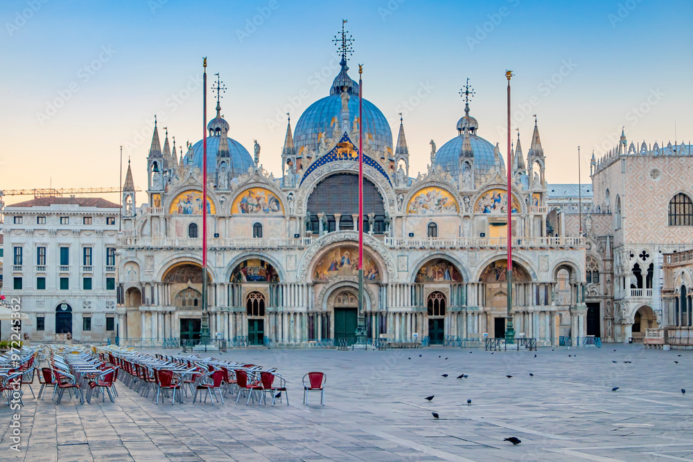 Sunrise in San Marco square with Campanile and San Marco's Basilica. The main square of the old town. Venice, Veneto Italy.