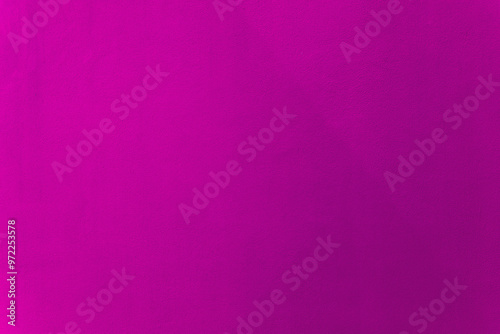 Pink or purple color paint on cement wall texture as background.