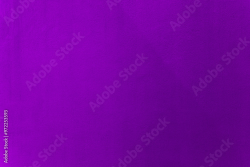 Purple color paint on cement wall texture as background.