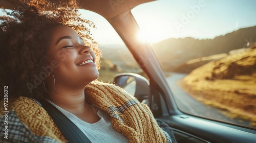 A plus-sized person enjoying a road trip, driving along a scenic route with the windows down and music playing photo