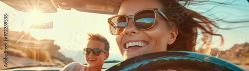 Smiling woman wearing sunglasses in a car.