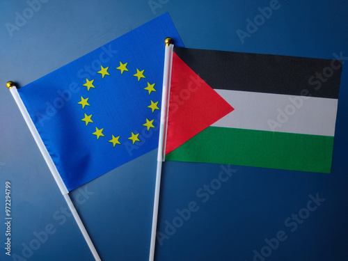 Top view european union and palestine flag on a blue background