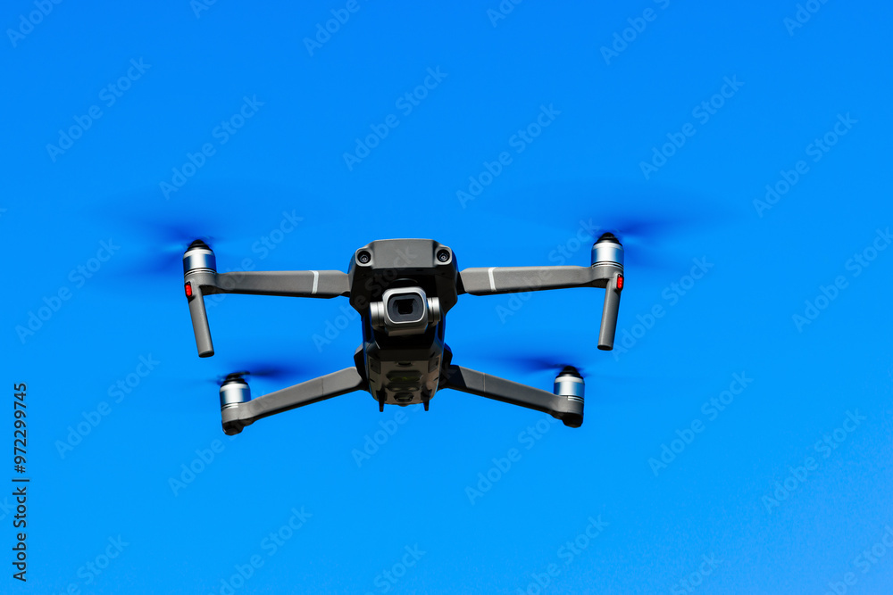 Drone fly in the blue sky. Drone Filming View. High quality photo. Drone fly in the blue sky. Drone Filming View. High quality photo.