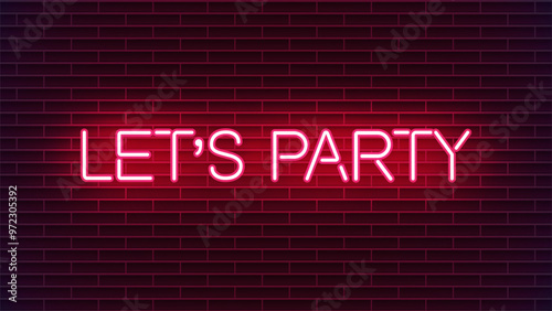Neon sign with let's party message on red brick wall