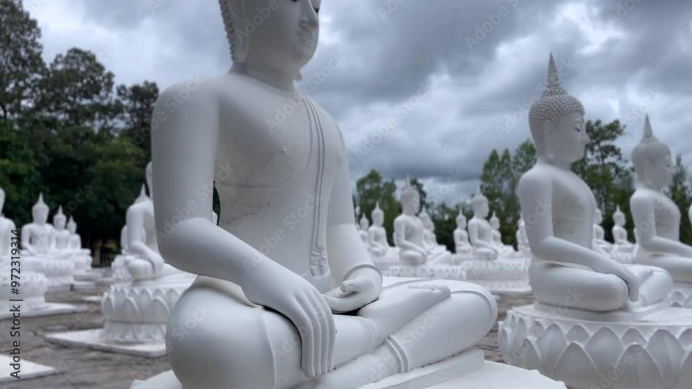 White Buddha Stone statue of a Buddha, Ubon Ratchathani Thailand, Buddha statue is immersed in meditation, Lord Buddha sculpture White Buddha Stone statue of a Buddha, Ubon Ratchathani Thailand, Buddha statue is immersed in meditation, Lord Buddha sculpture