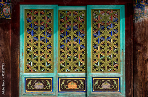 Pyeongchang-gun, Gangwon-do, South Korea - August 17, 2020: Colorful window door(Munsal) of Yeongsanjeon Hall at Sangwonsa Temple of Odaesan Mountain
 photo