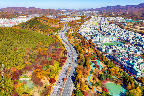 Sangnok-gu, Ansan-si, Gyeonggi-do, South Korea - November 8, 2020: Aerial view of Suin Road with Nojeokbong Peak and Seongho Park in autumn photo