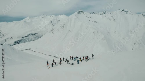 Freeride snowboarding in winter. Heliboarding freeride. Riding in powder on snowborad. Ski, Snowboard freeride i deep powder snow. Gudauri Georgia Caucasus resort. Freeride in Caucasus mountains.  photo