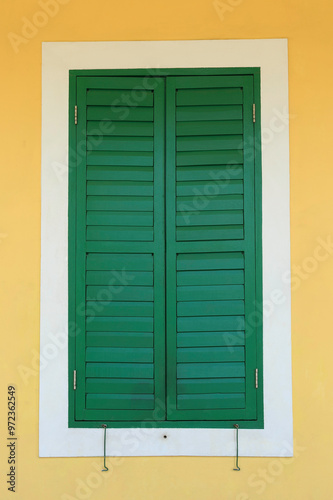 Macau, China - December 25, 2017: Green wooden window at a house of Coloane Island photo