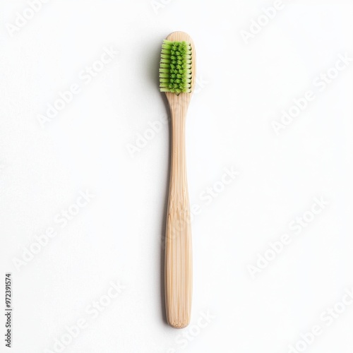 Single bamboo toothbrush is lying on a white background