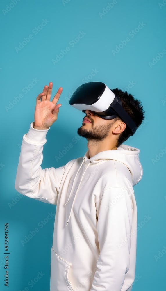Man Wearing Virtual Reality Headset Engaged in Digital Experience. Man Wearing Virtual Reality Headset Engaged in Digital Experience.