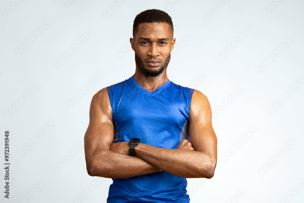 Personal Trainer. Confident black sports man standing with crossed arms isolated over yellow background. Copyspace Personal Trainer. Confident black sports man standing with crossed arms isolated over yellow background. Copyspace