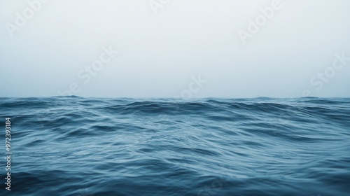 Wallpaper Mural A minimalist image of ocean waves rolling softly toward the shore, with a wide-open horizon in the distance Torontodigital.ca