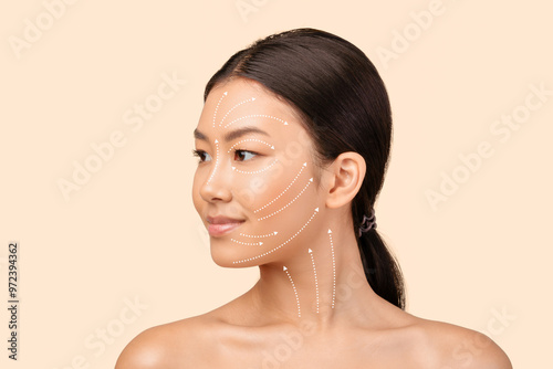 Obraz na płótnie Asian Woman's Face Portrait With Lifting Arrows Showing Antiaging Facial Skincare Treatment, Headshot On White Studio Background, Looking Aside