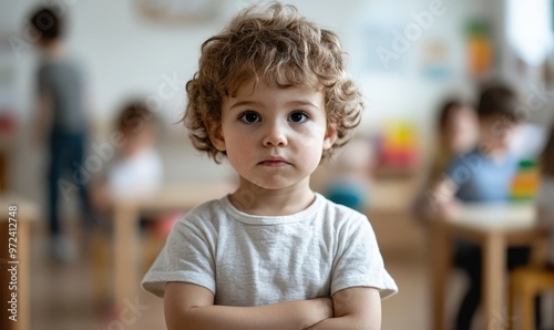 3-Year-Old Child Standing Apart in Kindergarten Looking Confused