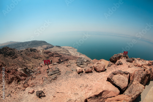 Exploring the rocky landscape of Nature Jordan near the coastline under a clear blue sky