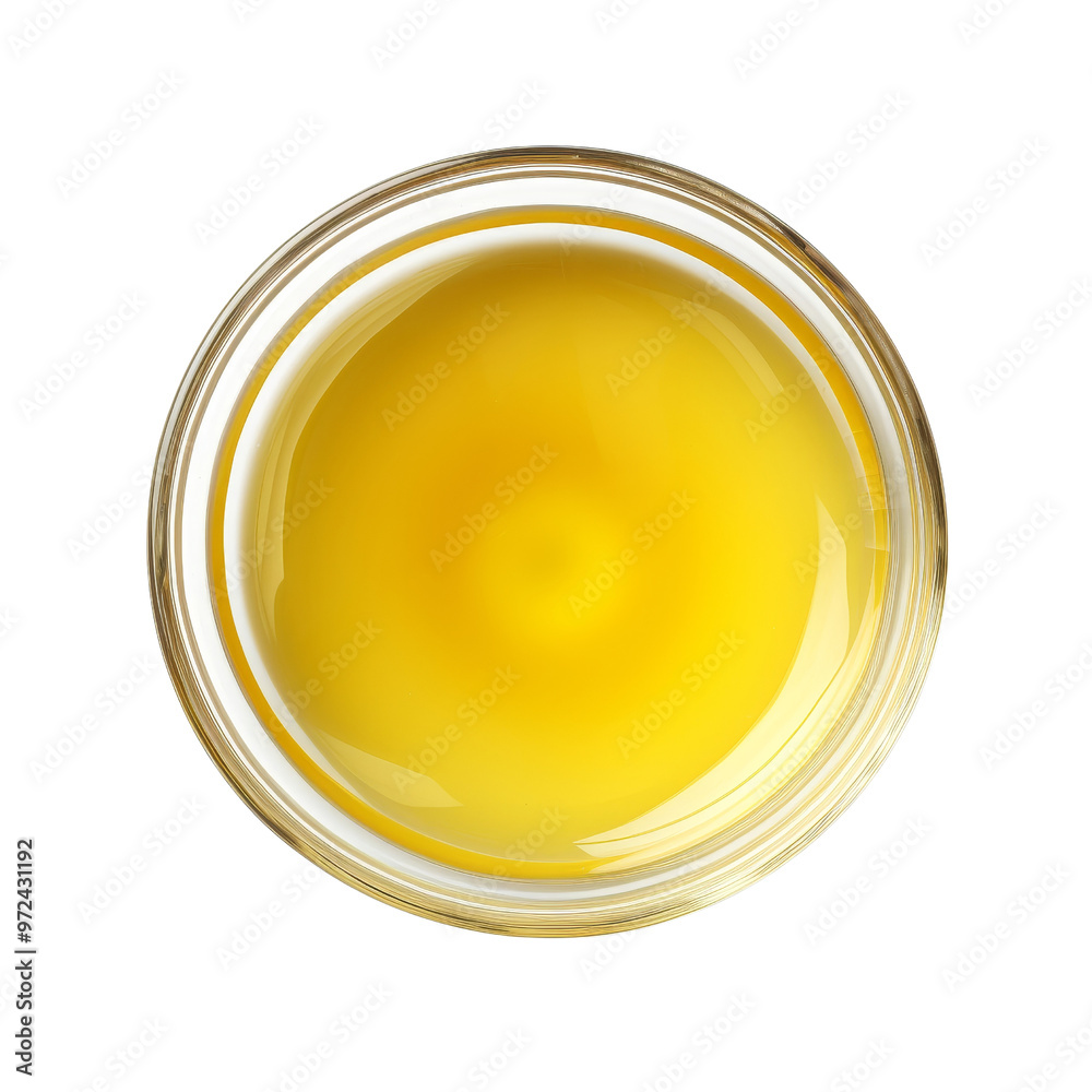 Close-Up View of Golden Oil in a Round Glass Container. Close-Up View of Golden Oil in a Round Glass Container.