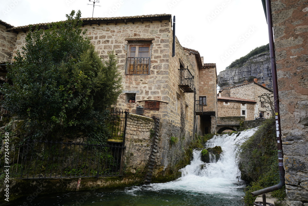 waterfall in Orbaneja Del Castillo village in ebro valley , Burgos province, Spain waterfall in Orbaneja Del Castillo village in ebro valley , Burgos province, Spain