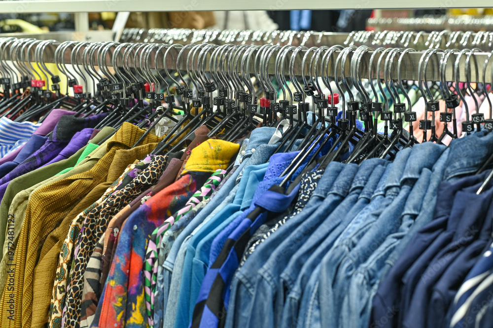 Fototapeta premium clothes in the store on hangers. concept