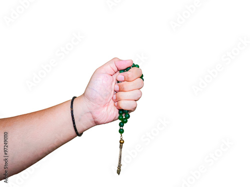 person's hand holding a green agate stone prayer beads tasbih isolated on white background photo