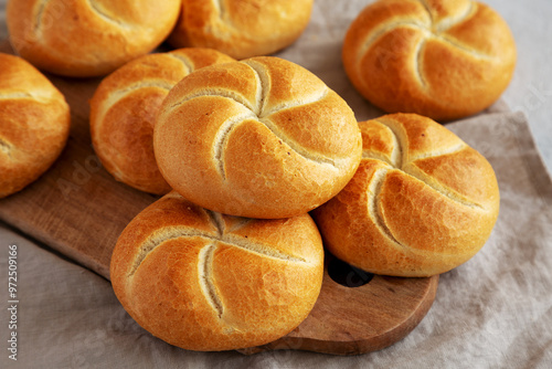 Tableau sur toile Homemade Kaiser Rolls on a wooden board, side view.