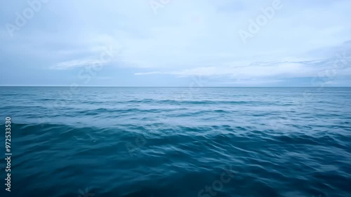 Expansive view of the calm ocean with a cloudy horizon
 photo