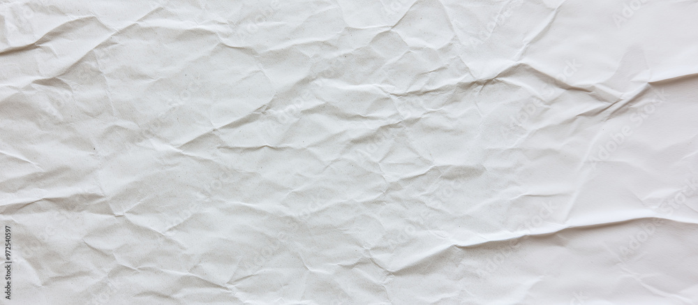 A close-up view of white recycled craft paper texture, highlighting its organic, slightly rough surface and small fiber details typical of eco-friendly materials. The background ha A close-up view of white recycled craft paper texture, highlighting its organic, slightly rough surface and small fiber details typical of eco-friendly materials. The background ha