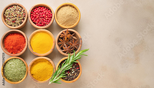 Top view of bowls with different types of herbs and spices placed on the table. Seasonal culinary background for the kitchen. With copy space