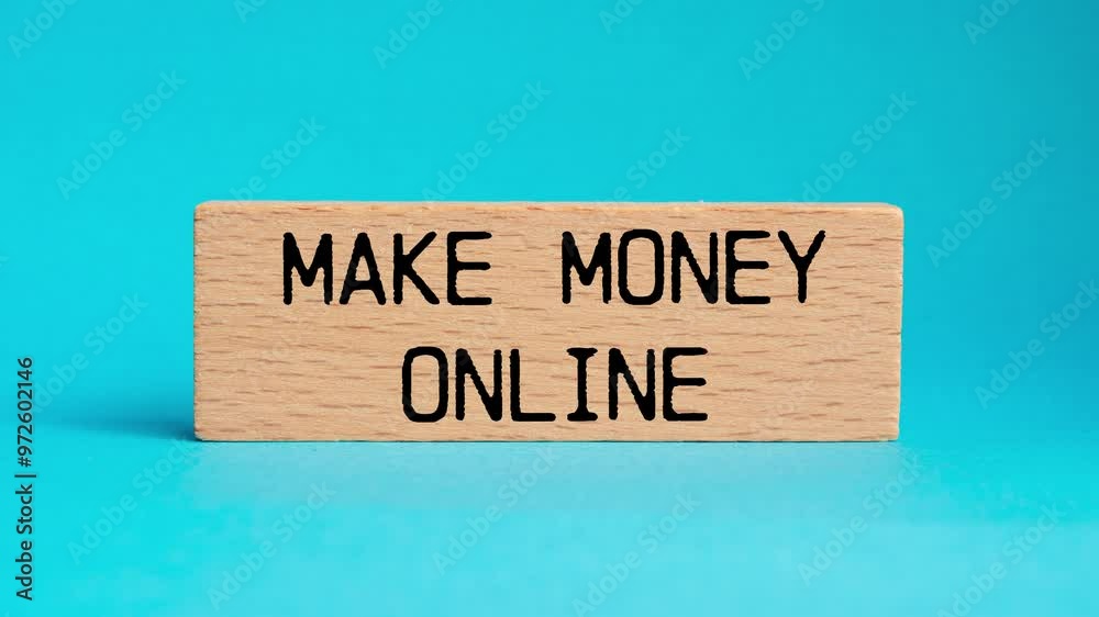 Make money online message writing on wooden block on blue background. Conceptual make money online symbol.