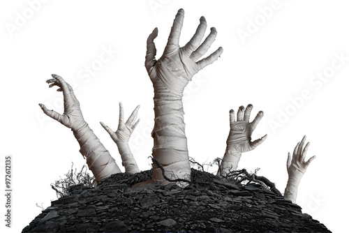 Mummy's hands wrapped in a bandage creepily moving reaches up through the ground grave on isolated background. The hand of the mummy monster for Halloween horror concept photo