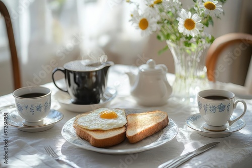 Elegant breakfast table, toast, eggs, coffee