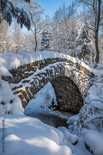 Fresh Snow Blanketing an Ancient Stone Bridge photo